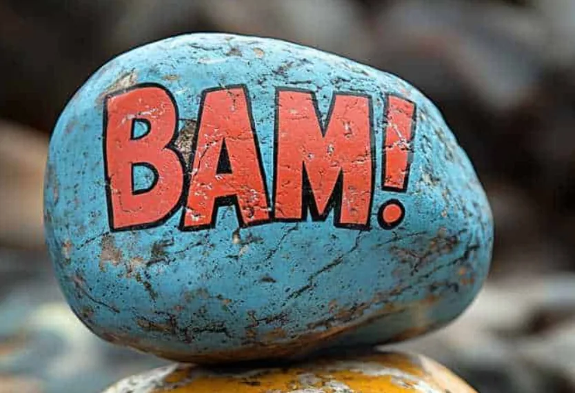 A rock painted with BAM lettering